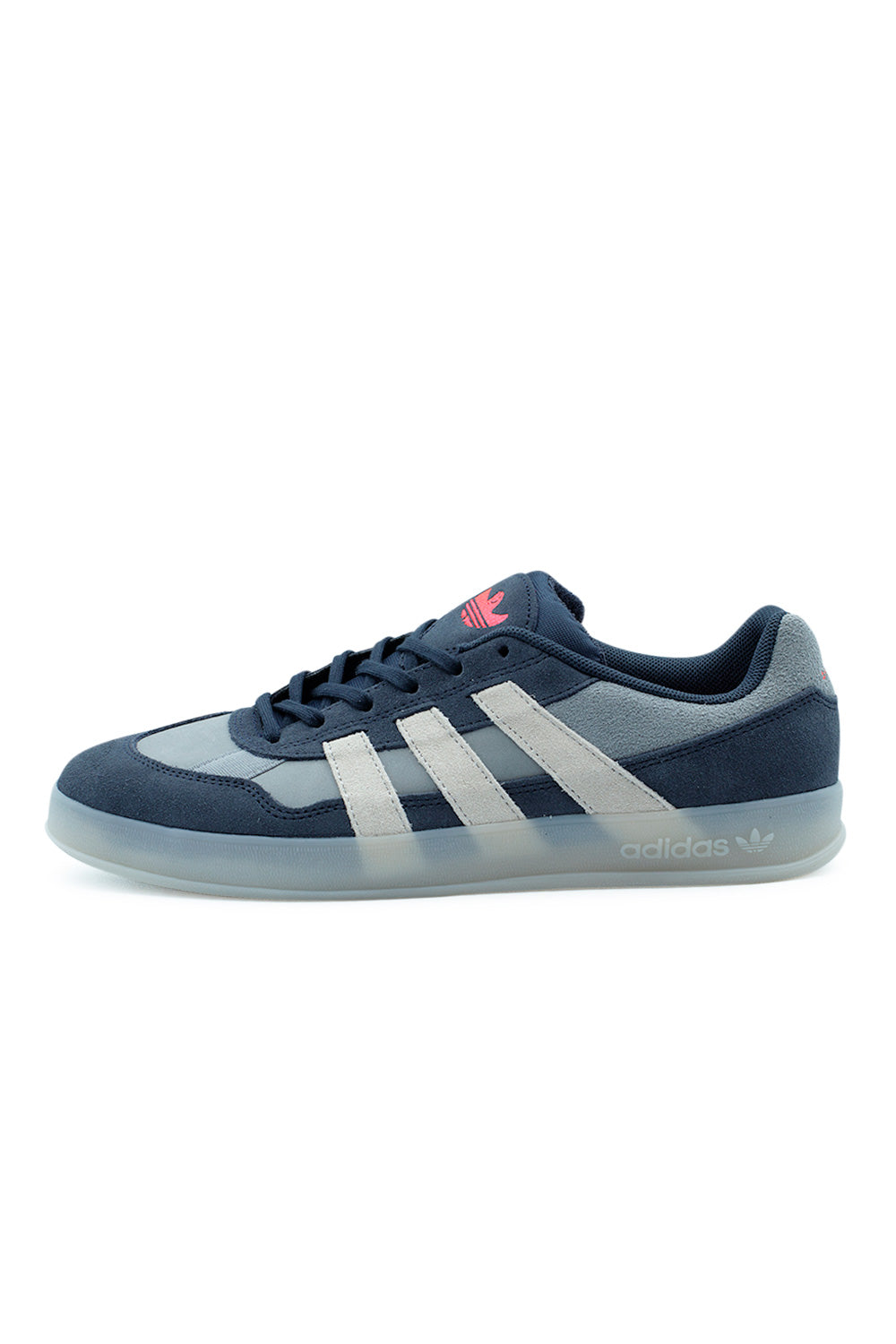 Lateral side view of the adidas Aloha Super skate shoe in Legend Ink, featuring dark navy nubuck, grey suede overlays, white three stripes, and a translucent cupsole.