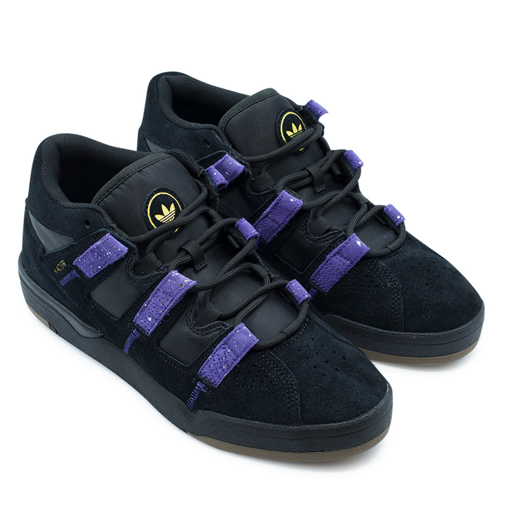 Pair angle studio presentation of the adidas Kader shoes in Core Black / Collegiate Purple / Gold Metallic, showcasing the bulky retro basketball skate design, thick ankle collar padding, contrast purple suede Three Stripes, round ghillie laces, and stitched black rubber cupsole units.