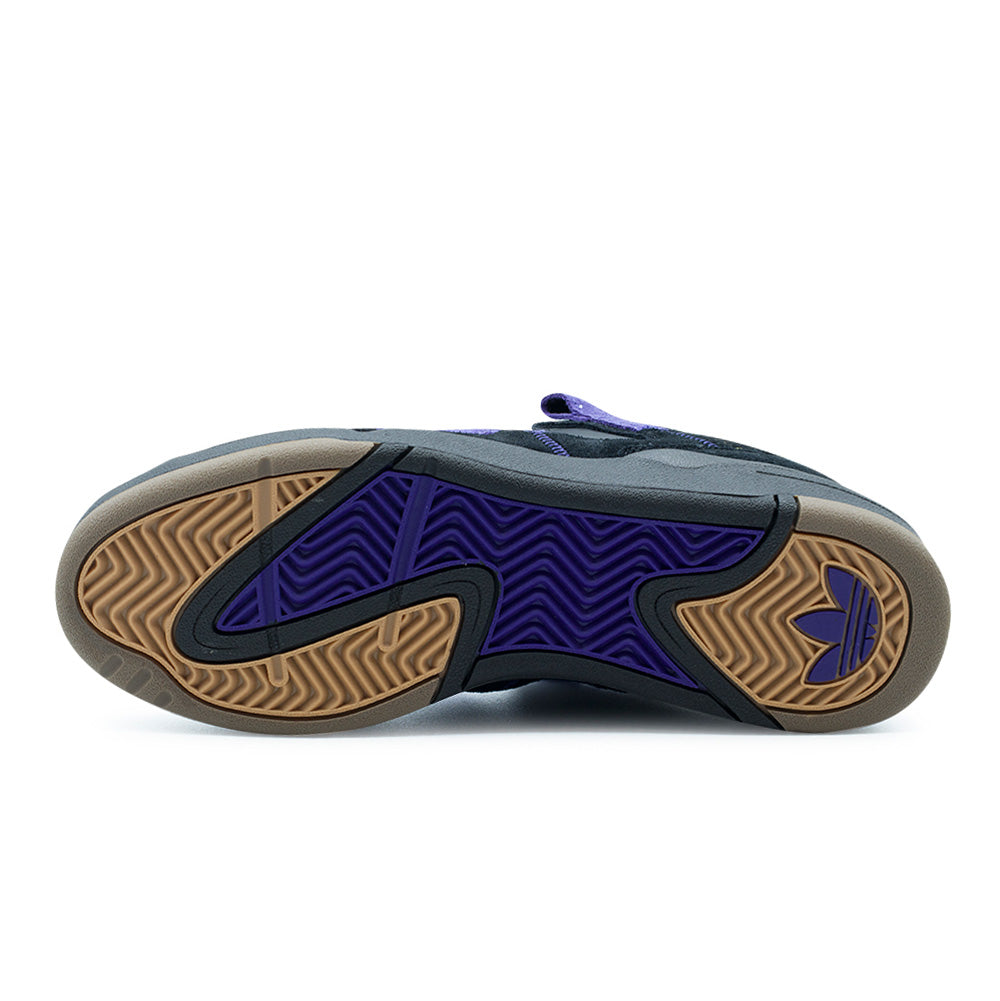 Full bottom studio view of the adidas Kader outsole, displaying the segmented high-traction herringbone tread with contrasting gum rubber zones, a prominent deep purple herringbone center panel, and a heel cup section debossed with an oversized adidas Trefoil logo.