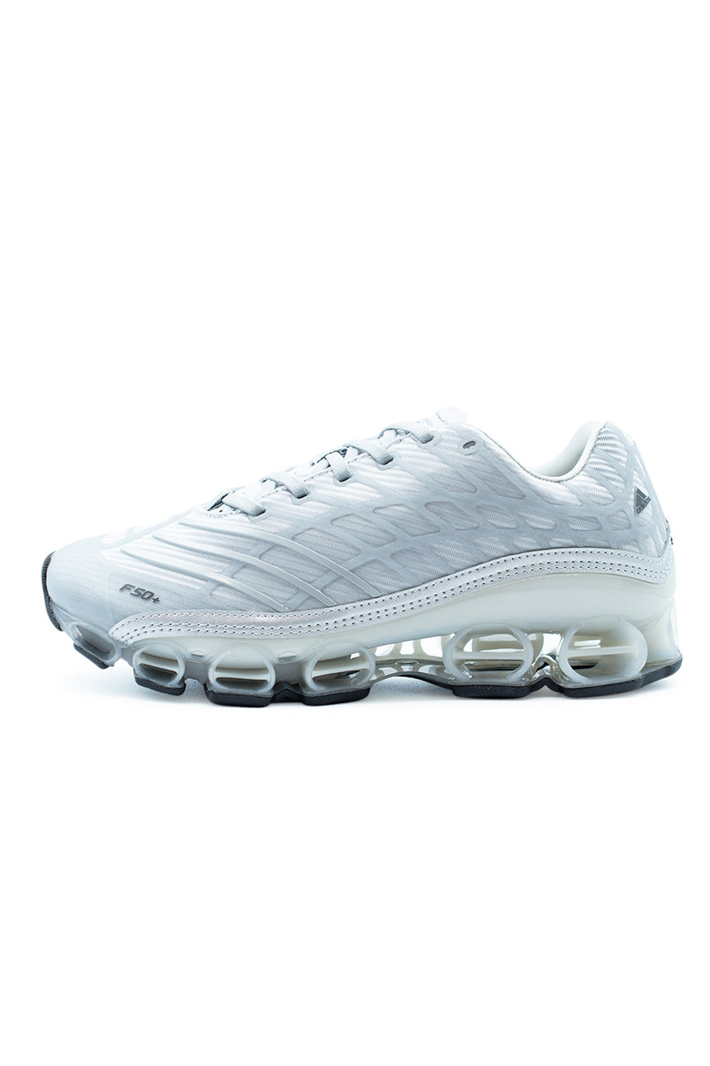 Adidas Megaride F50 Silver Metallic running sneaker side view featuring futuristic mesh upper, rubber overlays, visible Megaride cushioning pods and football-inspired design in Matte Silver Zero Metallic colorway.