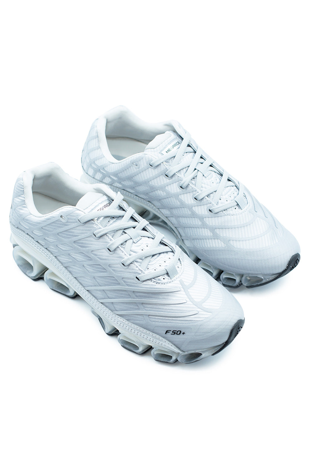 Angled pair shot of Adidas Megaride F50 lifestyle sneakers displaying reflective silver upper, Spider support framework, ventilated mesh panels and modern streetwear running silhouette.