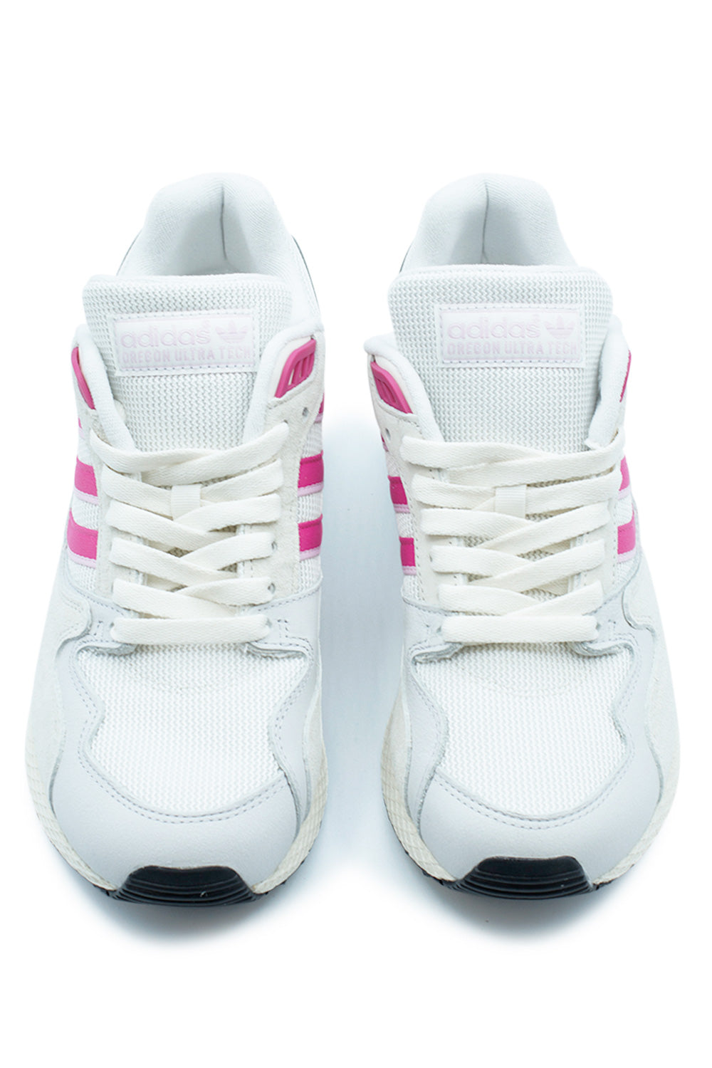 Front-facing view of the adidas Oregon Ultra Tech sneaker showcasing the iconic Three Stripes, lightweight mesh construction, padded tongue, classic lace closure and vibrant Cloud White, Semi Lucid Fuchsia and Orchid Fusion colorway.