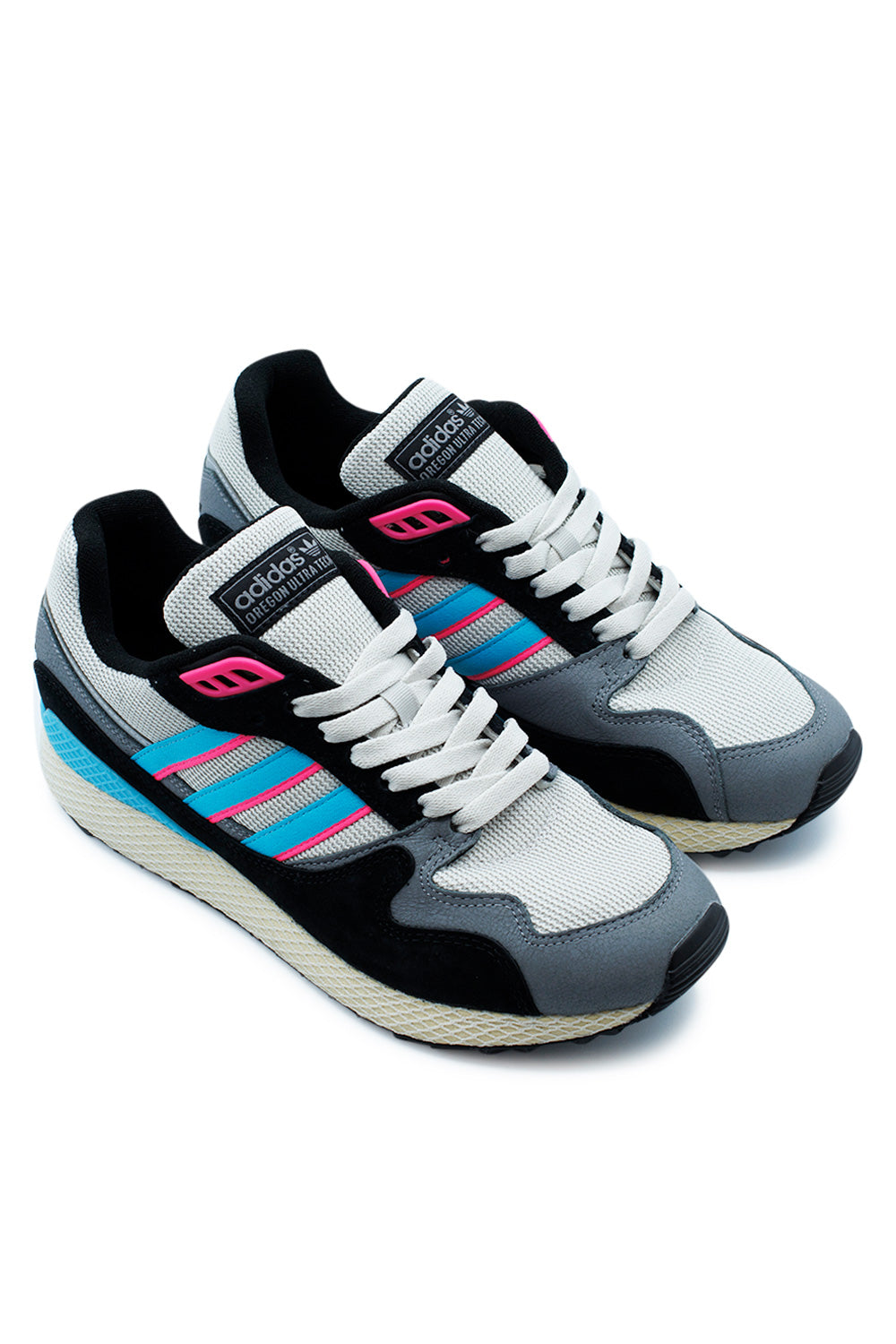Studio shot of a pair of Adidas Oregon Ultra Tech sneakers placed together at an angle, displaying the contrast between the premium brushed suede panels and breathable mesh inserts.