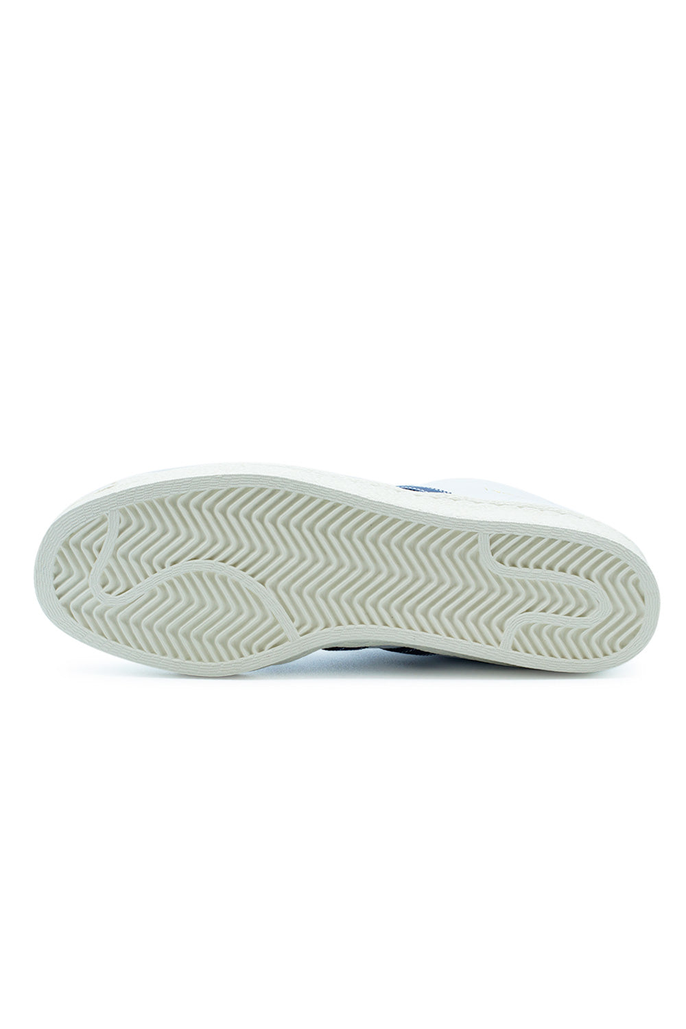 Full bottom view of the off-white rubber outsole of the adidas Pro Model 80 ADV sneaker, showcasing the classic herringbone traction pattern.