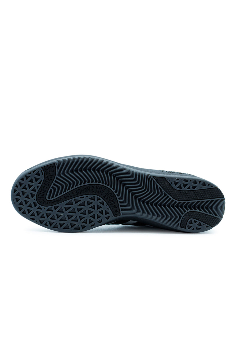Outsole detail of Adidas Puig Samba skateboard shoe displaying multi-surface traction pattern, grippy rubber sole and performance tread for skateboarding control