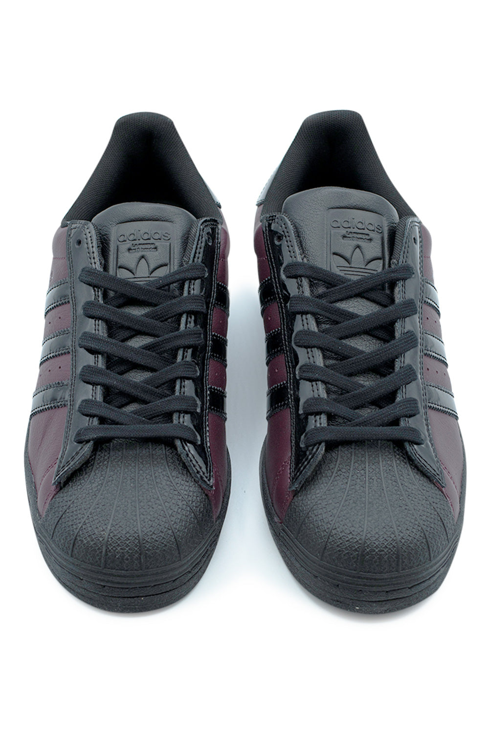 Front view Adidas Superstar ADV Montoya edition skateboarding sneakers maroon and black, classic shell toe design with padded tongue and secure lace system