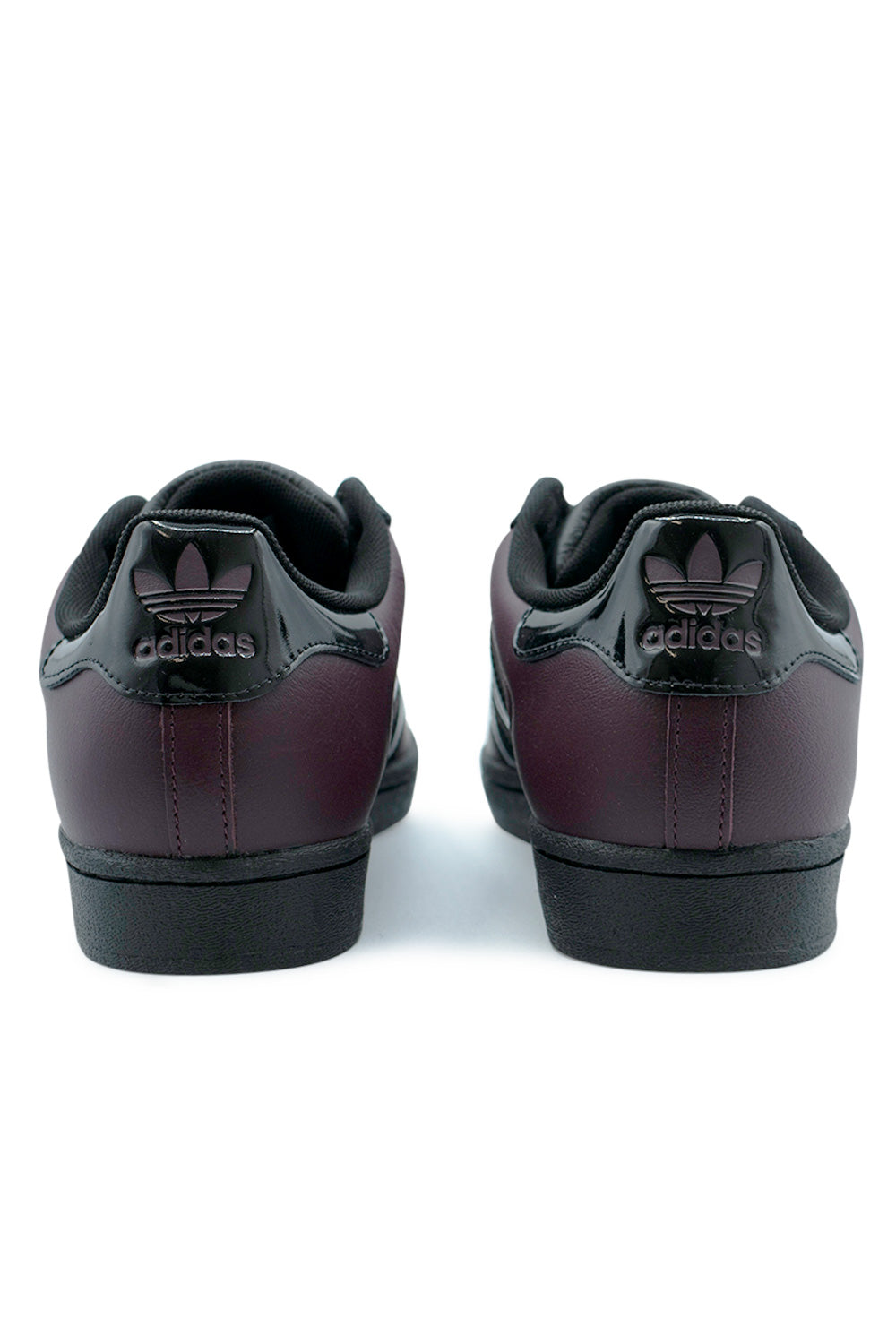Back view Adidas Superstar ADV maroon core black shoes featuring glossy patent leather heel tab and trefoil logo, reinforced skate shoe construction for durability