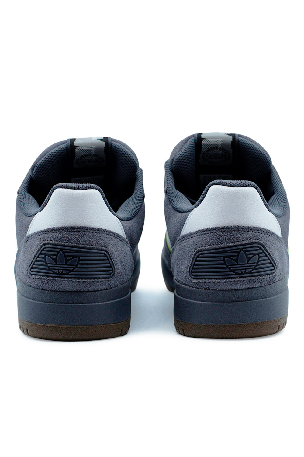 Heel view of Adidas Tekkira Cup showing the Lightmotion cushioning and neon green heel pull tab.