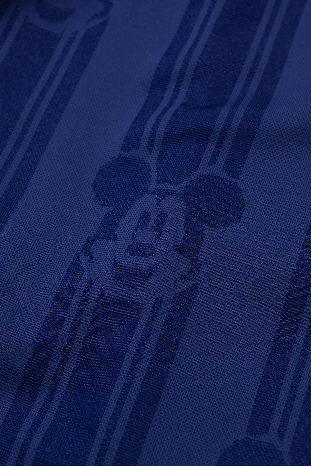 Close-up of the all over Mickey Mouse jacquard fabric on the adidas x Brain Dead x Disney Football Short Victory Blue showcasing premium polyester material inspired by iconic 1990s World Cup football kits