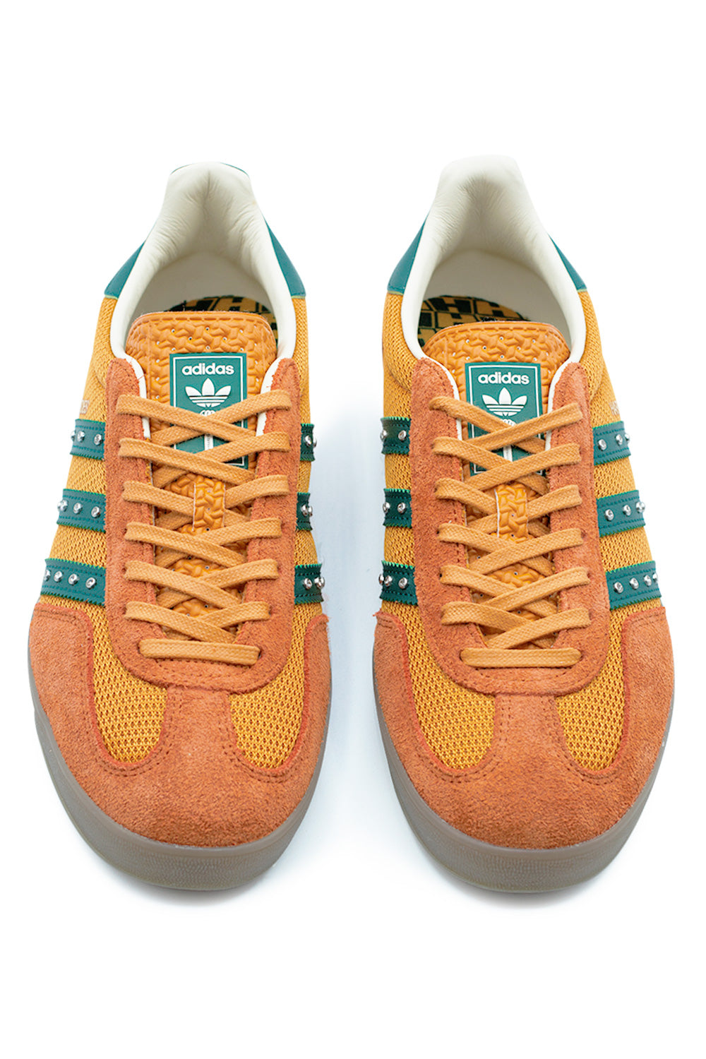 top view adidas Hardies Gazelle Indoor sneaker in rust orange with flat laces, textured tongue branding, mesh toe box and premium skate-ready construction with retro indoor silhouette