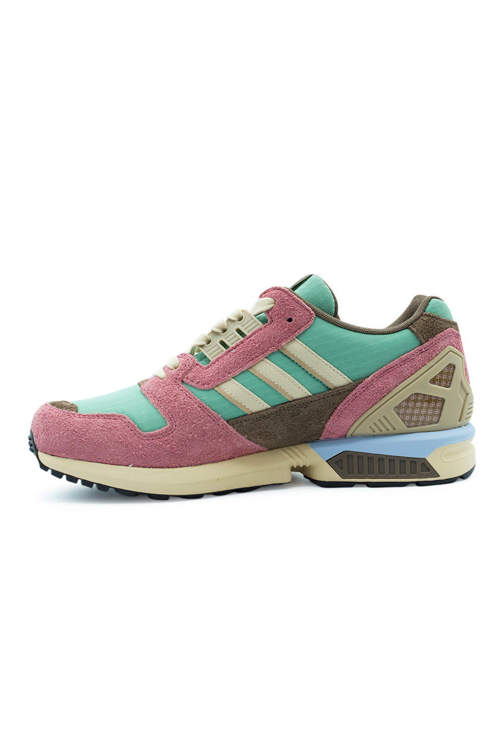 Medial arch profile view of the Adidas ZX 8000 shoe, showcasing the inner dusty pink hairy suede overlay, brown suede quarter wrap, light green ripstop underlay, beige serrated three stripes, grooved olive-tan midsole wedge insert, and external TPU heel support cage