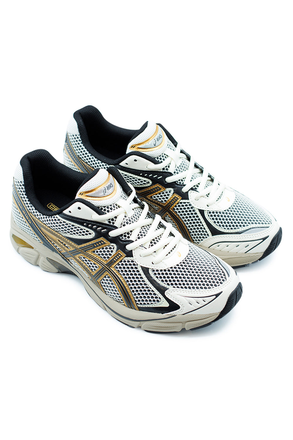 Side view of ASICS GT-2160 Cream Pure Gold, lifestyle running shoe featuring technical synthetic upper and signature ASICS wave-shaped structure.