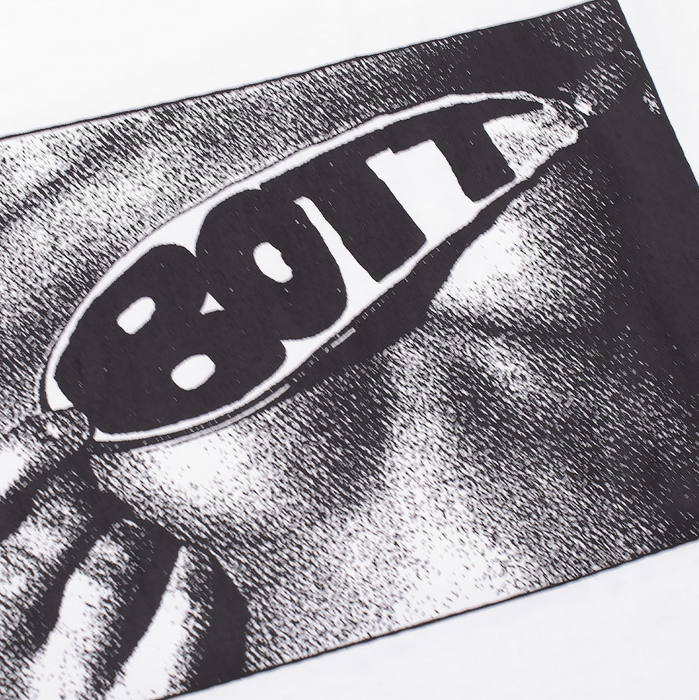 Detailed macro studio close-up of the monochrome chest screen print on the white BoTT Lust T-Shirt, highlighting the high-contrast grainy halftone texture and bold black "BOTT" lettering emblazoned across the mirrored oval sunglasses lens on smooth white cotton textile.