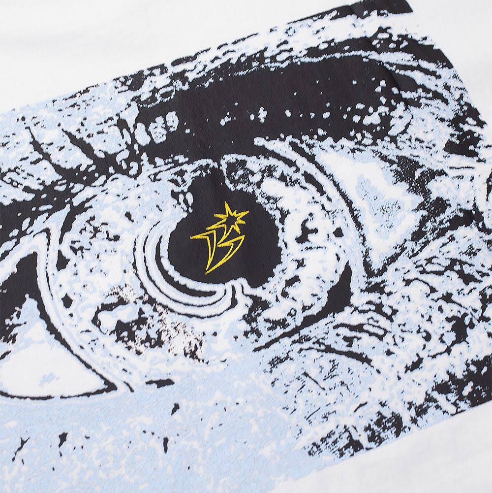 Detailed macro studio close-up of the back graphic on the white BoTT Ultra T-Shirt, highlighting the intricate woodcut-style linework and pale blue halftone gradient of the open eye print, centered around a yellow stylized star emblem in the pupil.