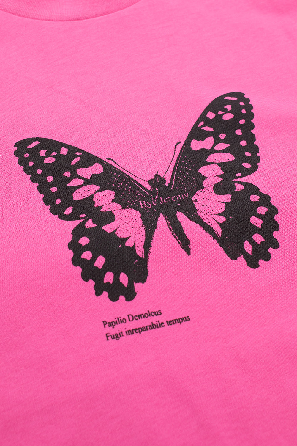 Close-up of the black screen-printed butterfly logo on the Bye Jeremy Pink Butterfly Tee, highlighting bold vintage skate aesthetics on heavyweight cotton.