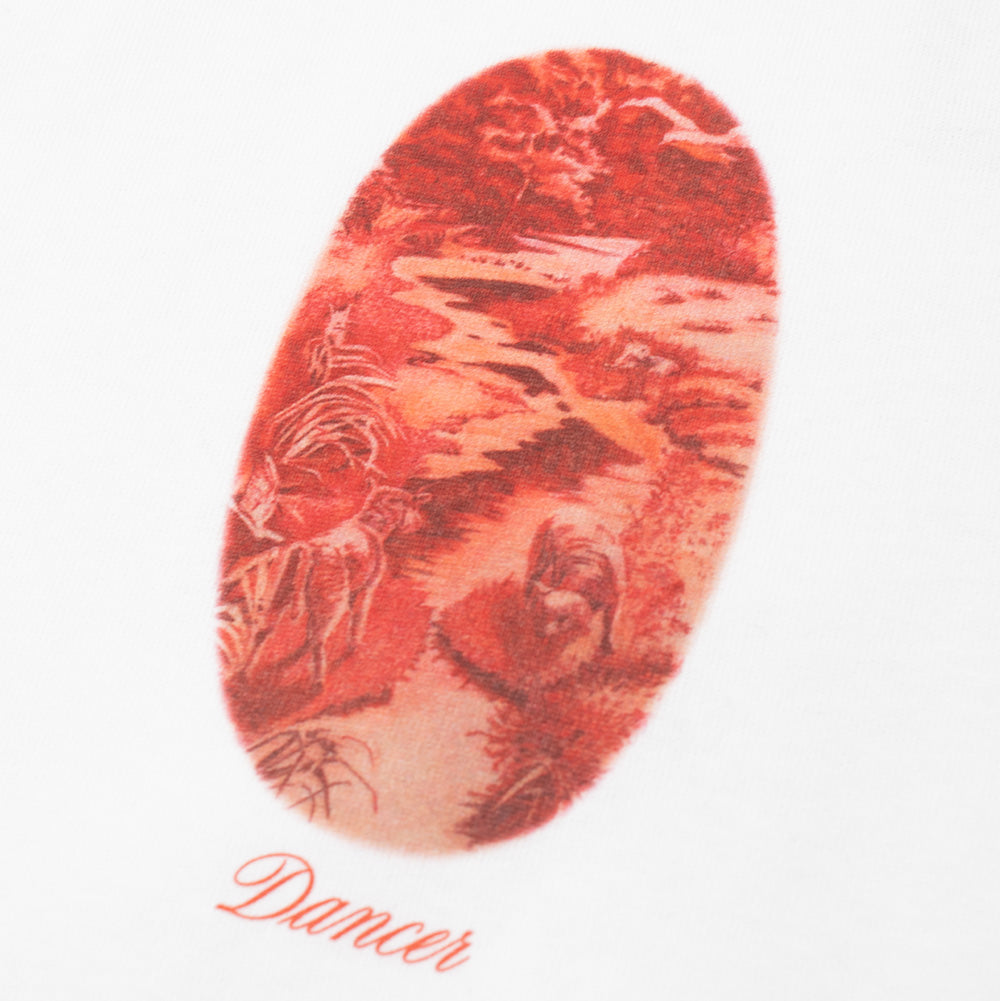 Macro studio close-up of the center chest print on the Dancer Safe Space T-Shirt, detailing the vintage-inspired monochrome red toile-style pastoral artwork depicting a serene nature scene with a winding river and walking deer within a vertical oval frame, underlined by the flowing "Dancer" script font printed cleanly onto white cotton twill jersey.