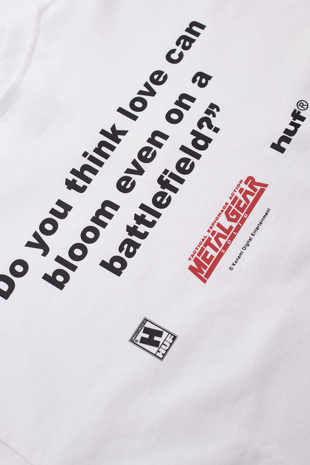 Close-up of back print text and Metal Gear Solid logo on HUF collaboration T-shirt from the Metal Gear Solid Legacy Collection