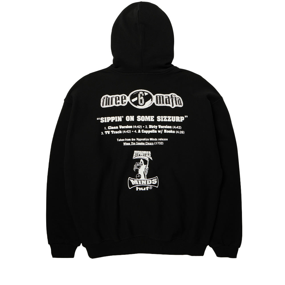 Back flat lay view of the black Huf X Three 6 Mafia Heavyweight Hoodie, displaying crisp white Memphis hip-hop tribute back graphics featuring the arched "three 6 mafia" logo, single release title "SIPPIN' ON SOME SIZZURP" with track durations, When The Smoke Clears album notes, and the iconic Hypnotize Minds hooded grim reaper clutching an hourglass above "huf®".