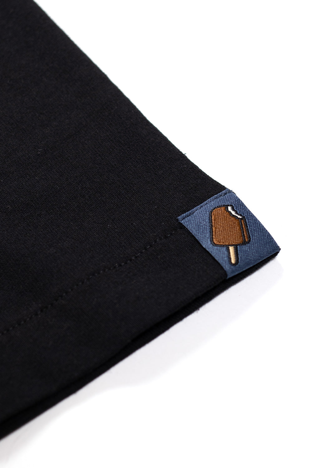 Ice Cream black tee with a cowboy boot logo design for a unique, edgy look