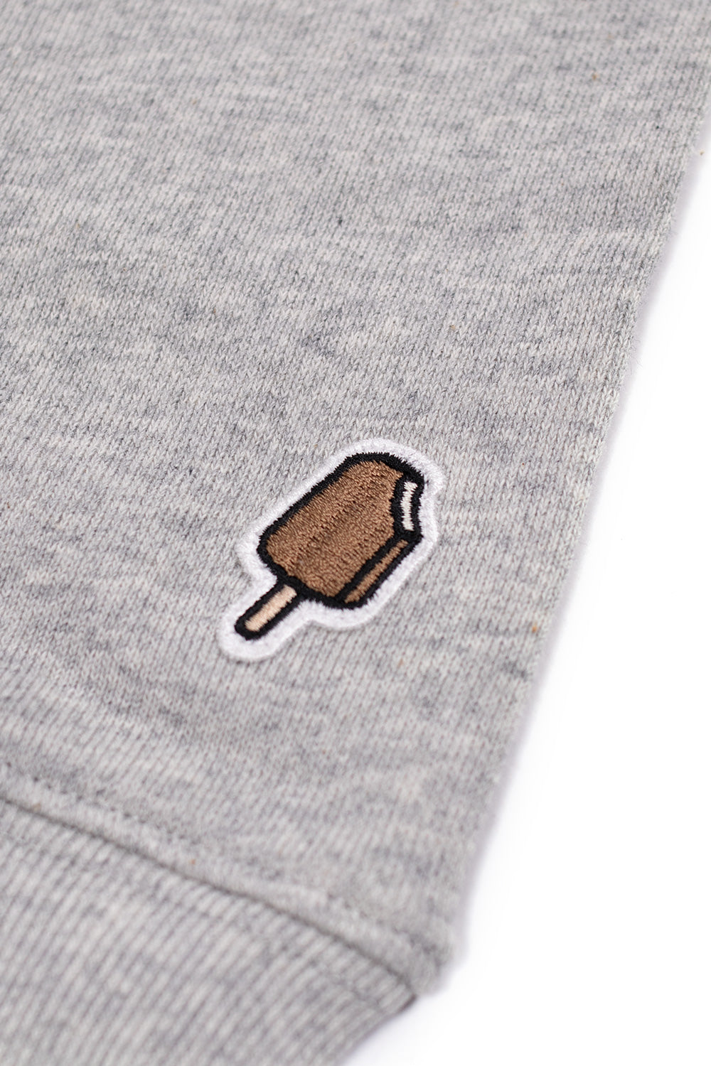 Casual heather grey crewneck by Ice Cream with a fierce leopard print and Running Dog graphic