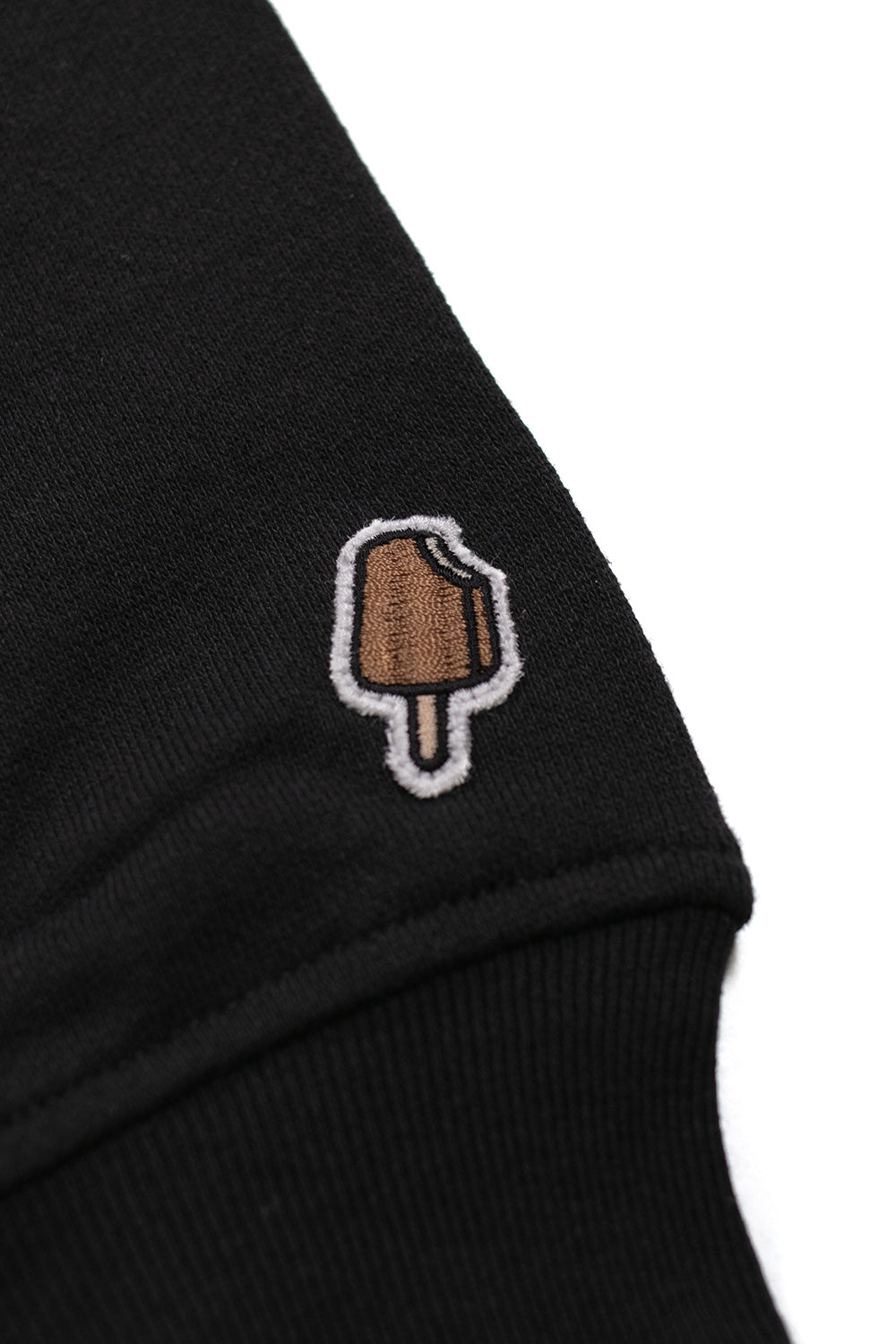 Ice Cream black popover hood featuring a striking red Running Dog graphic for urban look