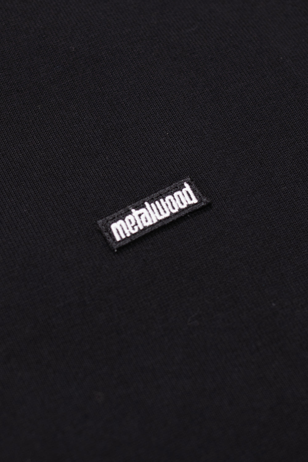 Men’s Metalwood Studio Heavy Mini Metal Logo Black T-Shirt, oversized streetwear tee with 100% cotton and sewn chest patch.