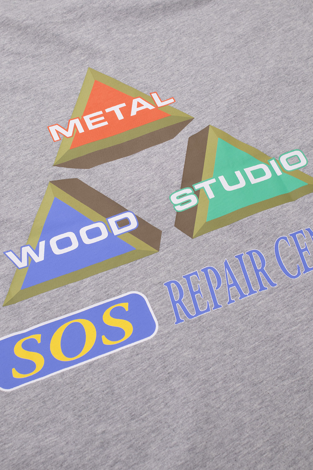 Detailed view of Metalwood Studio King Of The Greens graphic showcasing retro golf-inspired SOS Repair Center artwork with vibrant colors and premium print quality