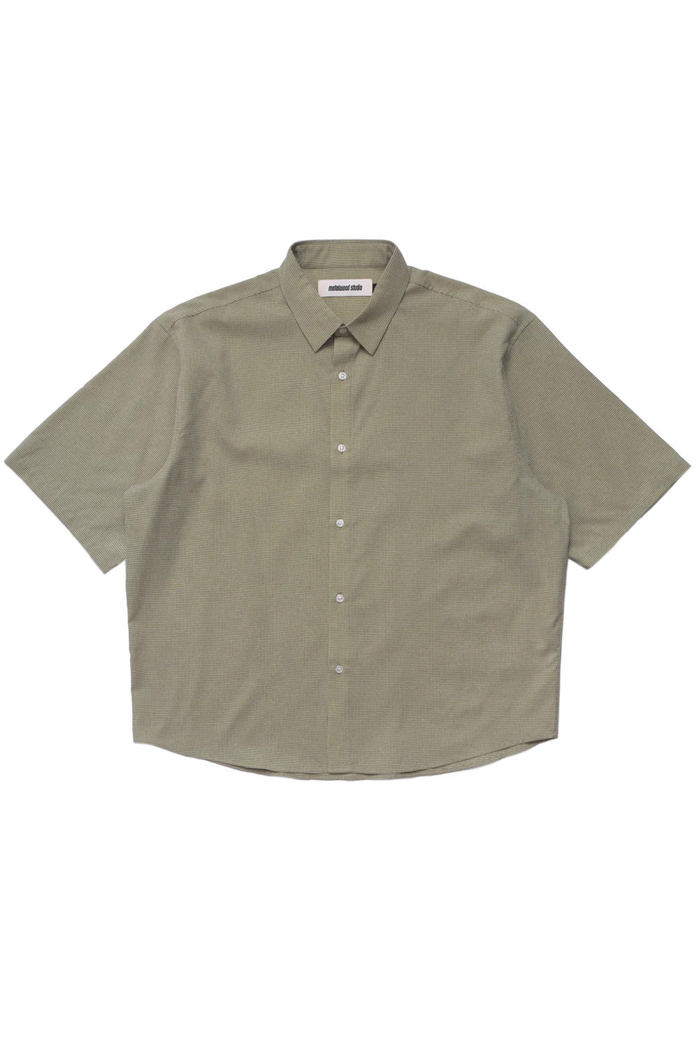 Oversized green button up shirt by Metalwood Studio crafted from a 70% polyester 30% cotton blend with a lightweight feel, classic collar and modern skate-golf aesthetic