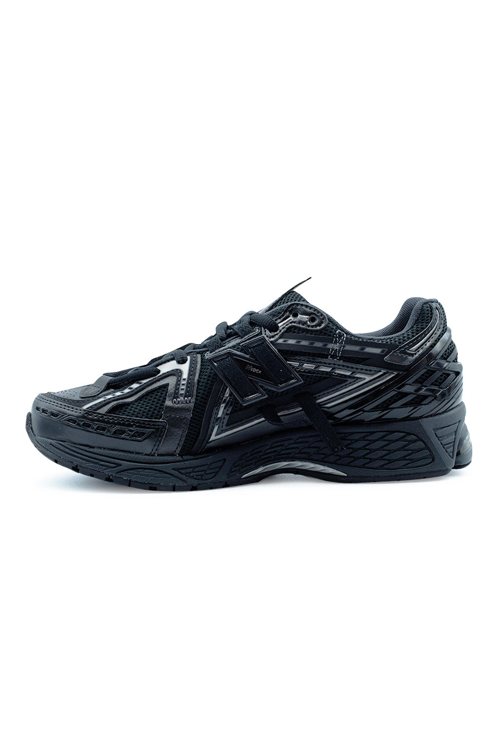Medial side profile of the New Balance 1906A Black Phantom runner featuring Stability Web arch support, lightweight ACTEVA LITE midsole, N-ergy shock-absorbing outsole and intricate Y2K-inspired structural overlay design.