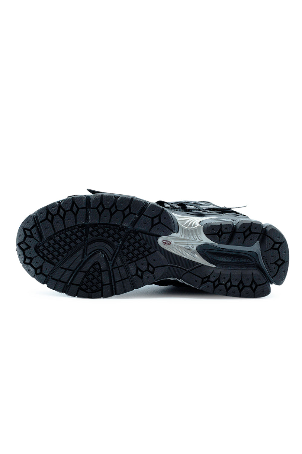 Bottom outsole view of the New Balance 1906A M1906AF showing the durable N-ergy rubber traction pattern, Stability Web midfoot support, multi-directional grip zones and performance outsole engineered for comfort, stability and everyday wear.