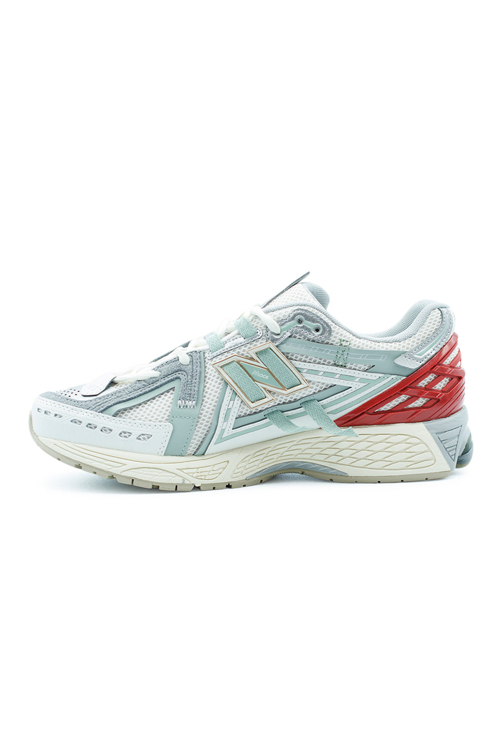 Lateral angle of New Balance 1906A retro-tech sneaker highlighting sculpted midsole, N-ergy outsole technology, breathable engineered mesh and signature NB logo branding