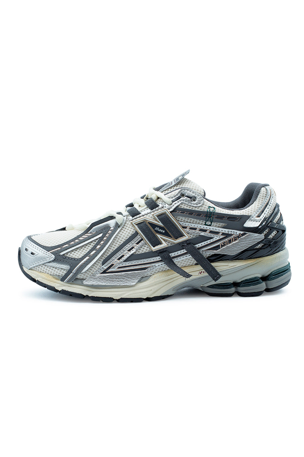 Side profile of the New Balance 1906A M1906AD in Silver Metallic, Castlerock and Gold Metallic featuring a deconstructed Y2K running silhouette, breathable mesh upper, layered synthetic panels, ABZORB cushioning and signature N-Lock support system.