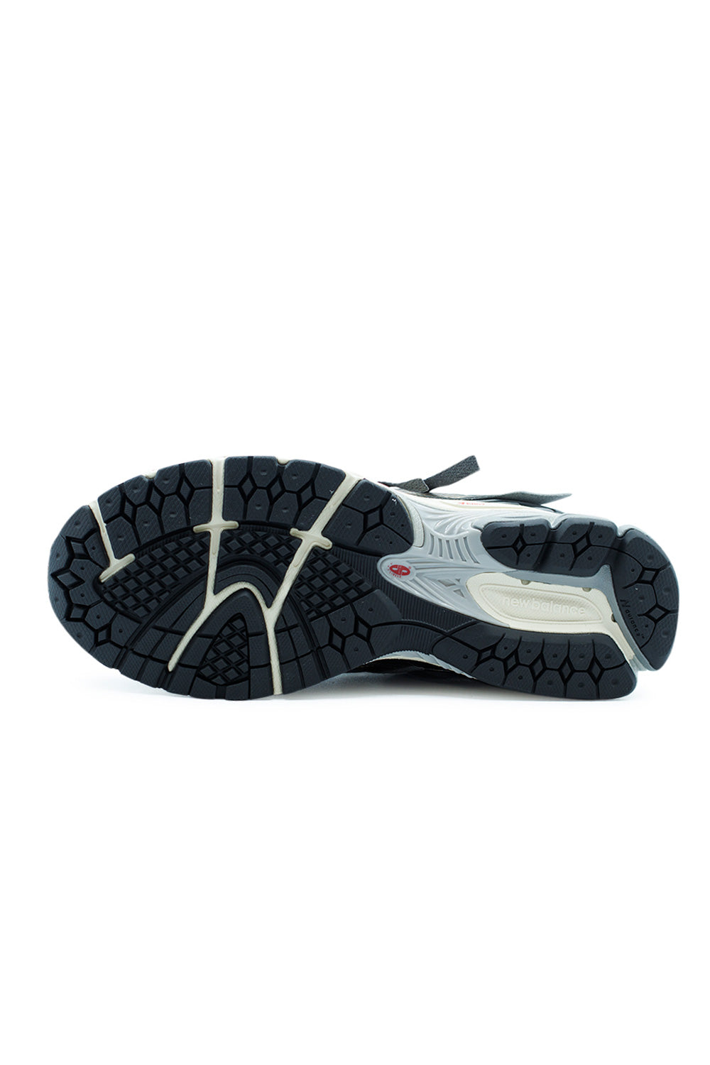 Rubber outsole detail of New Balance 1906A Thunder Brown Slate Grey running-inspired sneaker with durable traction pattern, flex grooves and high-grip tread for everyday wear