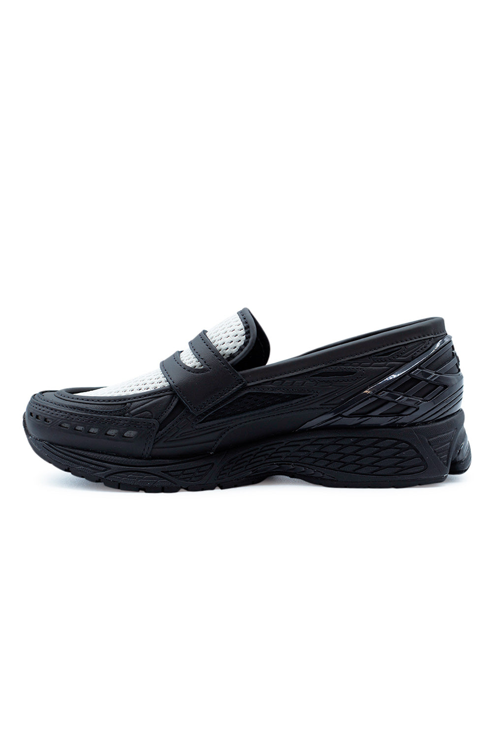New Balance 1906L Black / Angora hybrid loafer sneaker featuring leather and mesh upper, technical overlays and a performance-driven sole, redefining modern luxury footwear.
