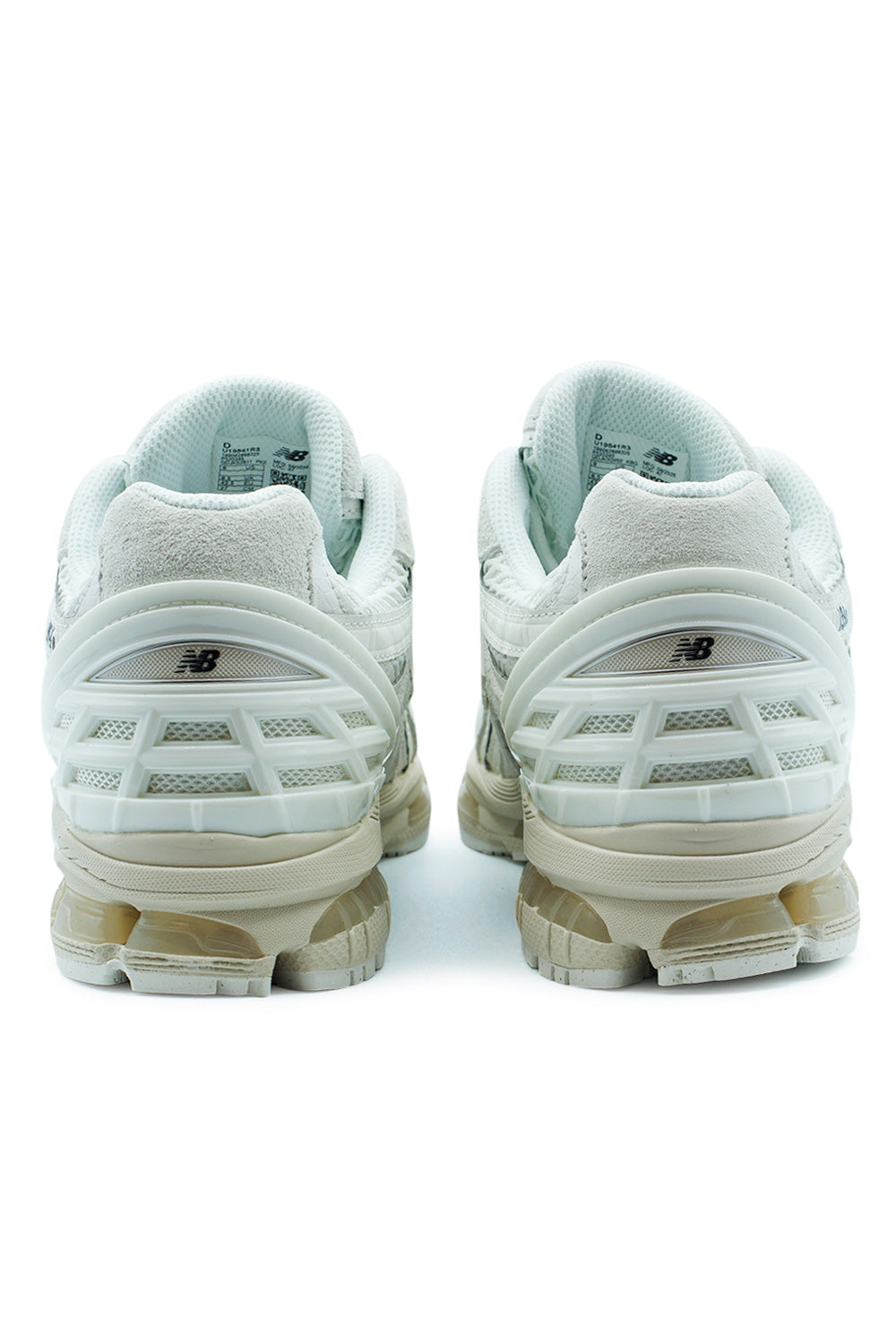 Rear view of the New Balance 1954R Sea Salt sneaker highlighting the molded heel cage, ABZORB midsole technology, segmented cushioning platform and technical running heritage blended with premium everyday lifestyle comfort.