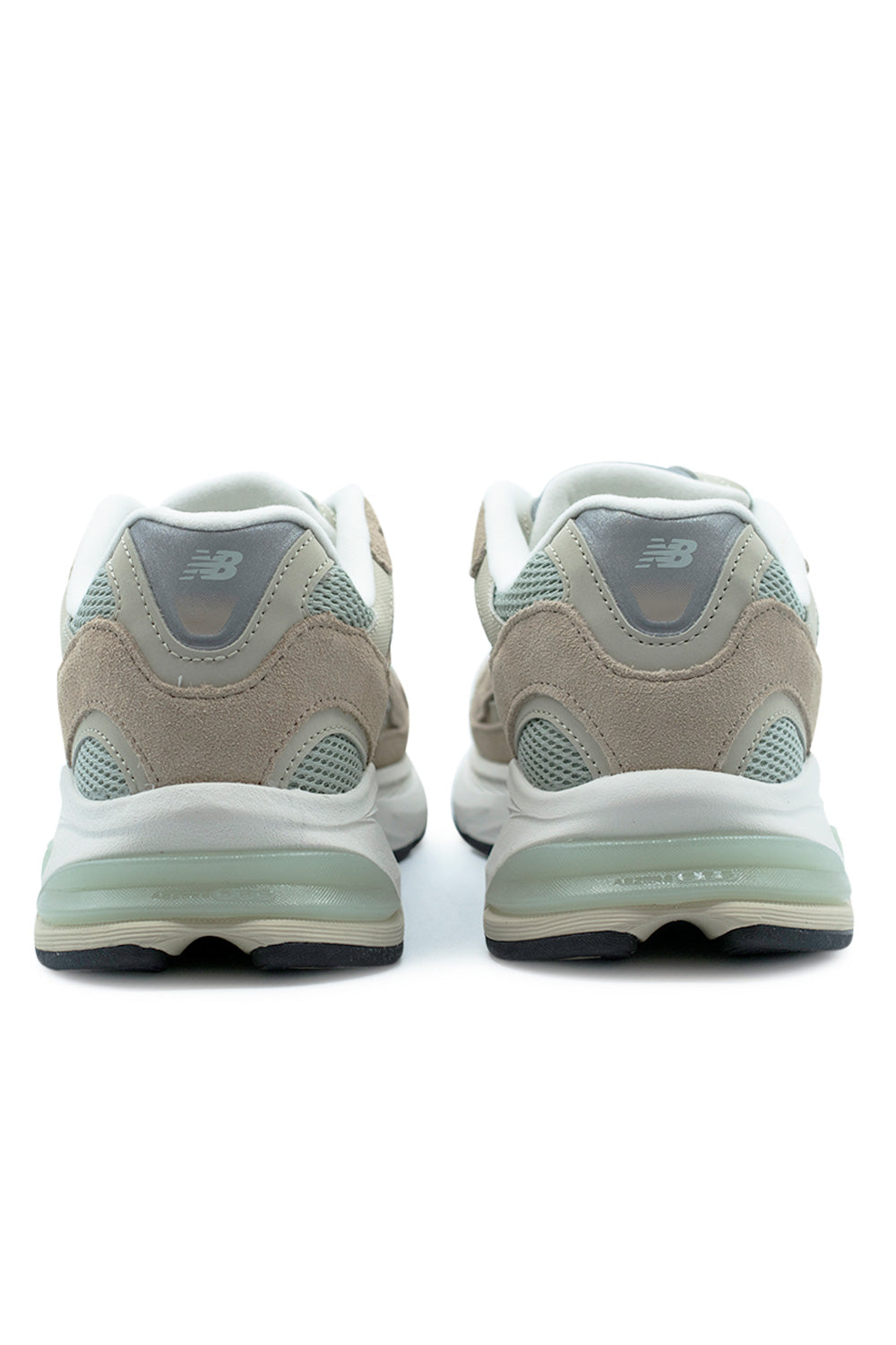 rear angle New Balance 2010 showcasing ABZORB SBS heel cushioning, molded support structure and reflective branding in modern 2000s inspired running design