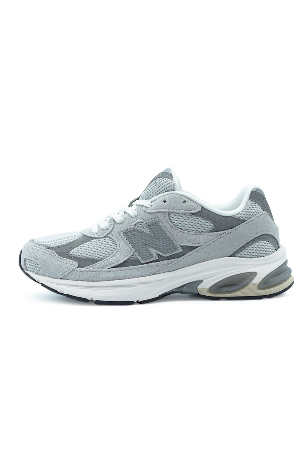 New Balance 2010 Raincloud Harbor Grey White sneaker side profile with layered suede and mesh upper, oversized ABZORB cushioning sole and modern Y2K running aesthetic