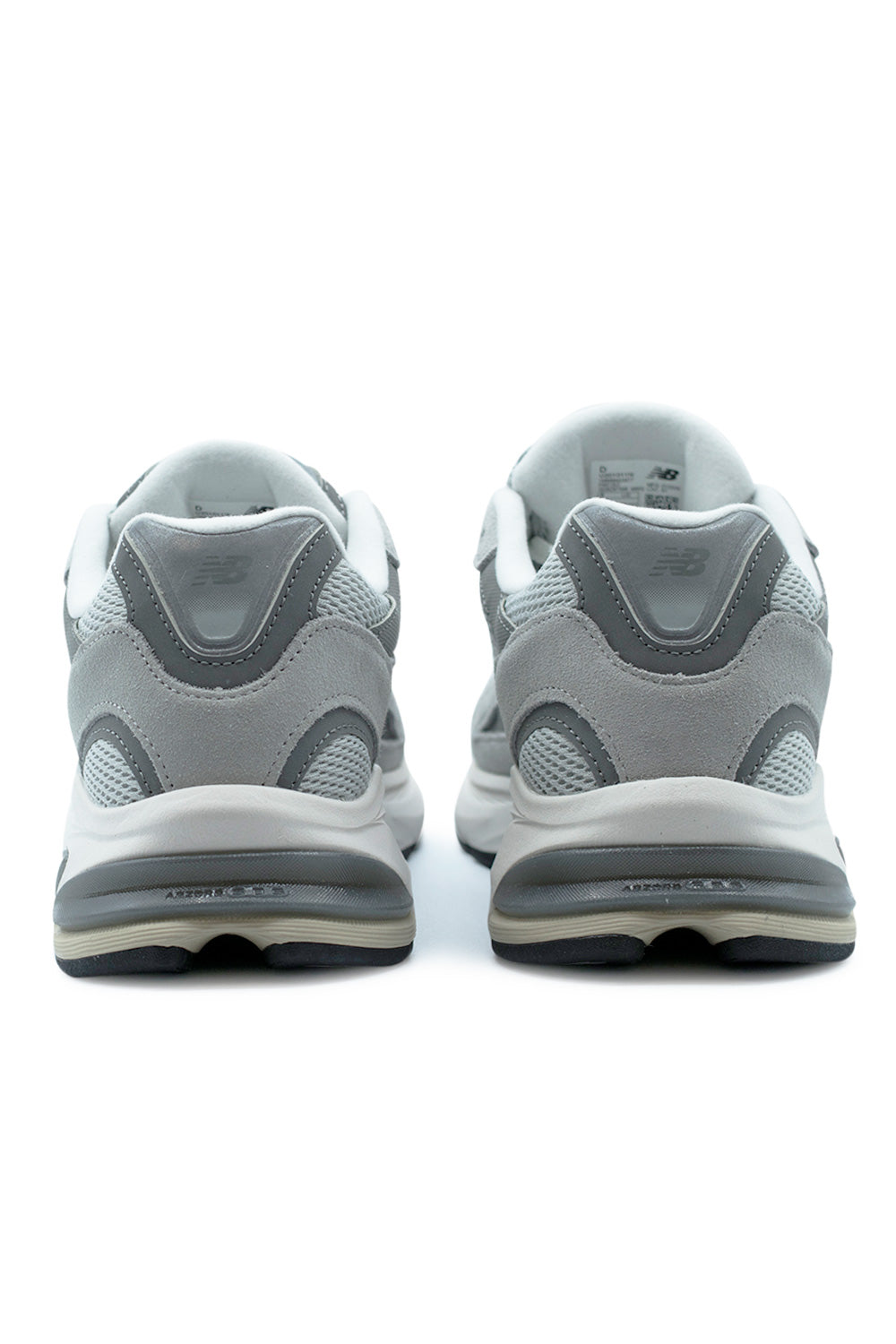 rear view New Balance 2010 showcasing ABZORB SBS heel cushioning unit, sculpted midsole geometry and reflective accents in grey and white technical runner