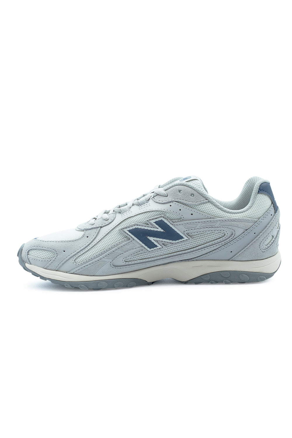 three quarter perspective New Balance 204L highlighting premium suede textures, airy mesh upper construction and sleek 70s inspired runner silhouette with contemporary updates