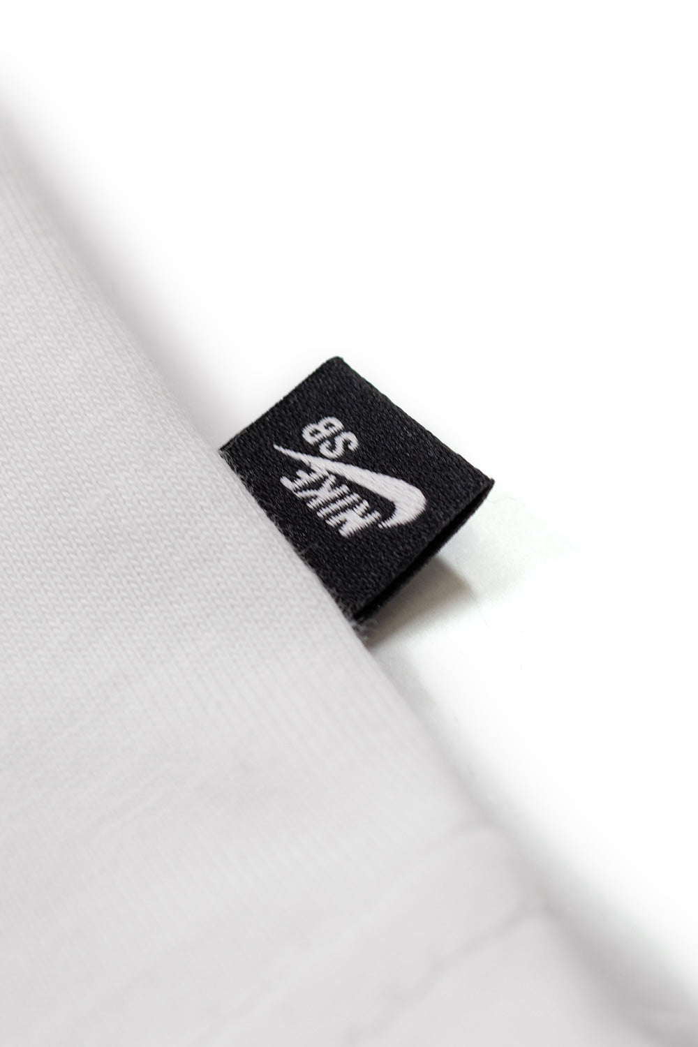 Nike SB M90 Koston T-Shirt White, loose-cut skate tee from Eric Koston collection with Nike SB branding, embroidery, and durable cotton build.