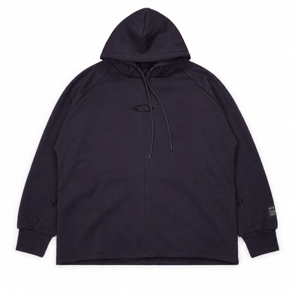 Front flat lay studio view of the Oakley FGL Slick Fleece Hoodie 6.7 in Phantom, showcasing an outdoor technical hooded pullover in deep washed black, featuring an integrated high-neck hood with matching round drawstrings, subtle tonal chest logo embroidery, vertical center seam construction, concealed side zipper pockets with ergonomic pullers, wide ribbed hem and cuffs, and an authentic Oakley FGL utility patch on the left sleeve cuff.