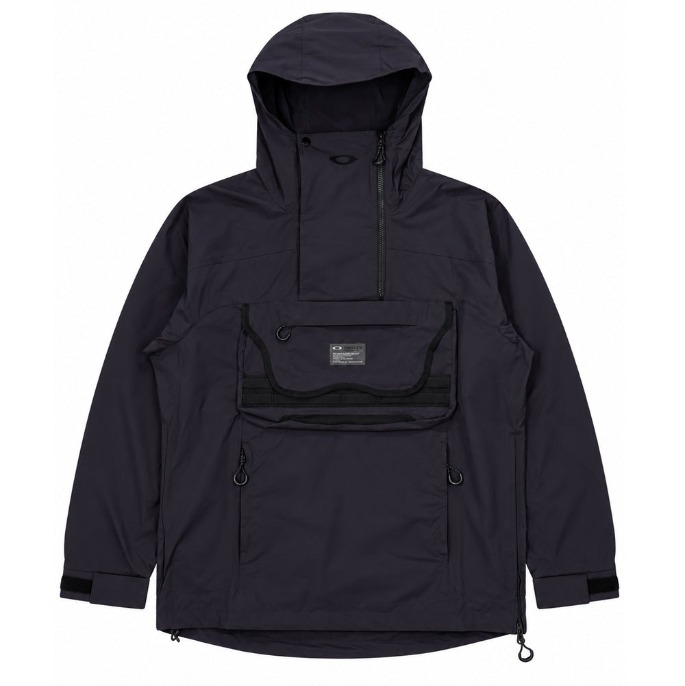 Front flat lay studio view of the Oakley FGL Stroke Anorak 6.7 in Phantom black, showcasing an outdoor technical pullover jacket tailored from durable, water-repellent woven fabric, featuring an integrated storm hood with asymmetrical neck zip and snap flap, an oversized modular front pouch pocket with utility webbing loops and branded spec patch, zippered kangaroo hand pockets, velcro cuff adjusters, and an entry side zipper with hem cinch cords.