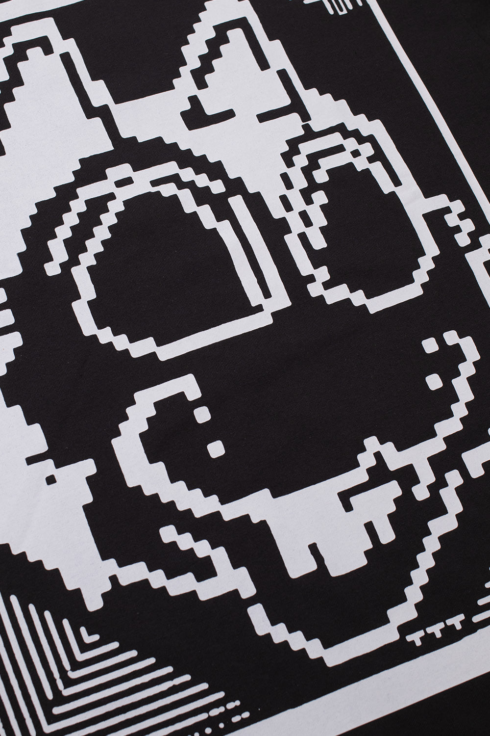 Front view of the The Trilogy Tapes Digicta T-Shirt Black featuring a loose oversized fit, heavyweight 100% cotton construction, bold Digicta pixel character graphic printed across the chest and signature underground streetwear aesthetic inspired by London's experimental techno, electronic music and graphic art scene.