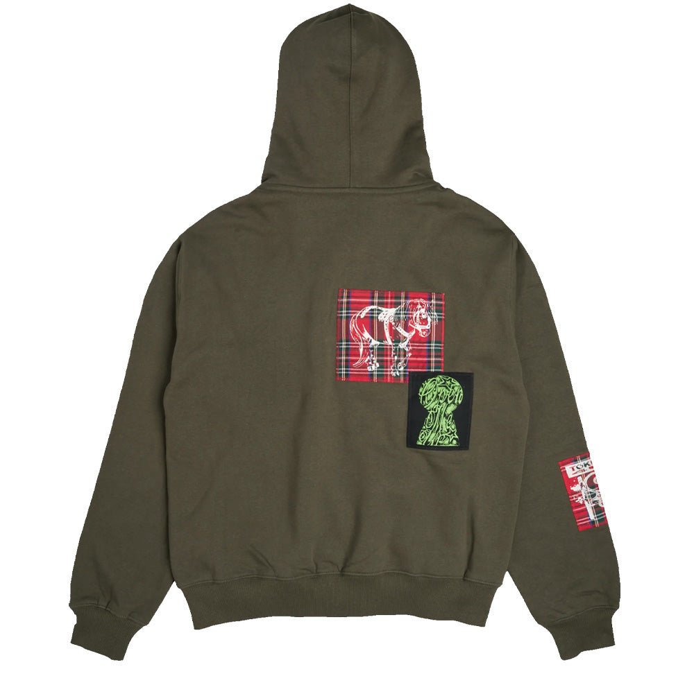 Back flat lay view of the olive green Token Carly Zip Hoodie, displaying a wide-cut back panel detailed with an offset red Royal Stewart tartan patch printed with a white horse sketch, paired with a stitched black patch featuring a lime green keyhole graphic below it, and a tartan patch on the right cuff.