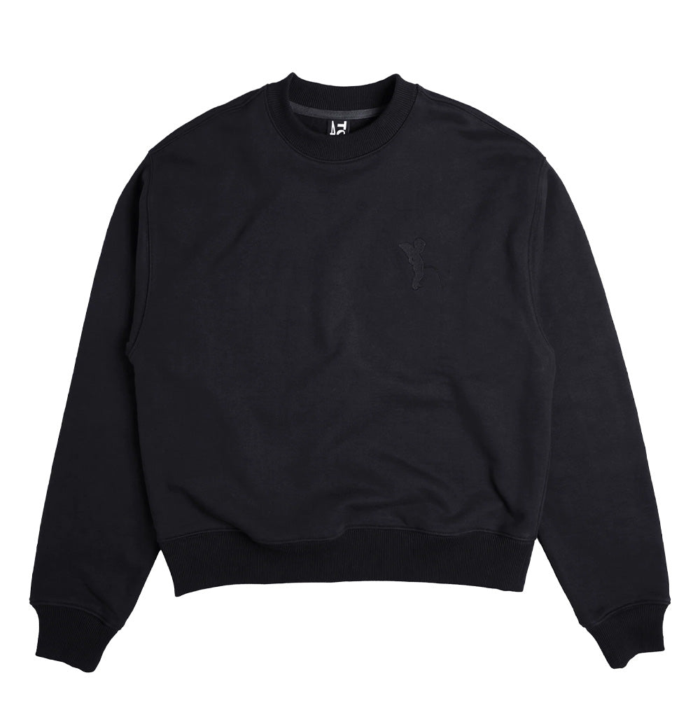 Front flat lay view of the black Token Grand Crewneck sweatshirt, displaying a clean minimalist streetwear aesthetic in heavy premium brushed cotton, fitted with wide ribbed knit cuffs, ribbed collar, matching thick ribbed waistband, and a discreet tonal black embroidered logo on the left chest.