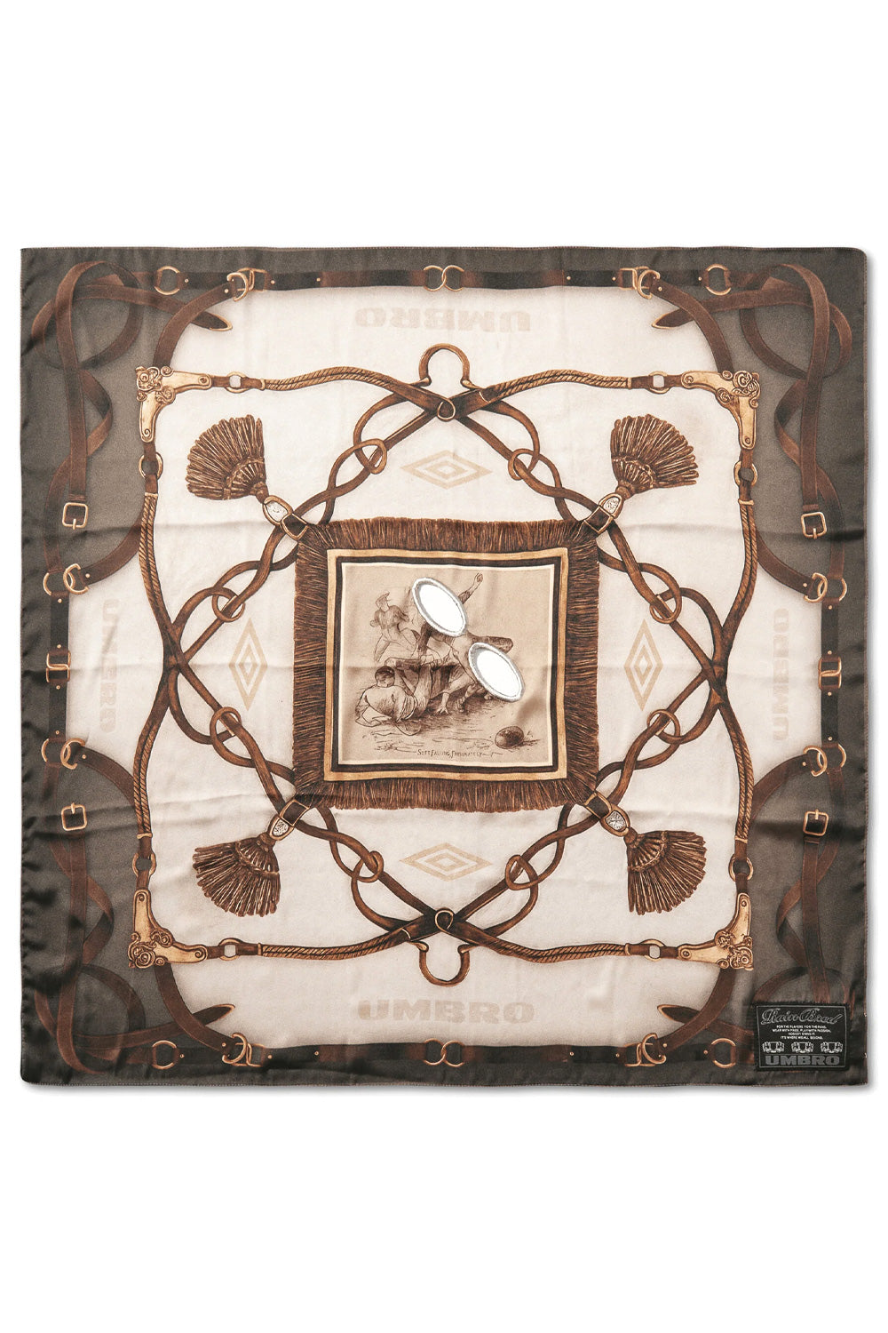 Full flat lay overview of the square Umbro Belt Masked Foulard measuring roughly 68 by 68 cm, crafted in Italy from 100% printed polyester fabric, displaying an intricate equestrian belt, stirrup, and tassel motif in olive, brown, and beige tones framing a central framed vintage football sketch with two embroidered oval eye slits and a woven black Umbro label in the bottom right corner