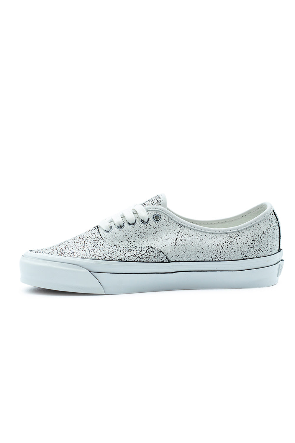 Medial side view of the Vans LX Authentic 44 Overpaint sneaker in Blanc De Blanc, detailing the continuous crackled paint finish across the inner suede panel and the smooth white vulcanized sidewall.