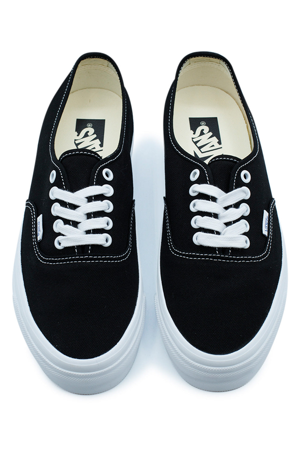 Top view of the Vans LX Authentic Reissue 44 Black White showcasing durable heavyweight canvas construction, white cotton laces, metal eyelets, full-grain leather collar lining and authentic premium craftsmanship from the Vans Premium Collection with vintage Anaheim-inspired detailing.