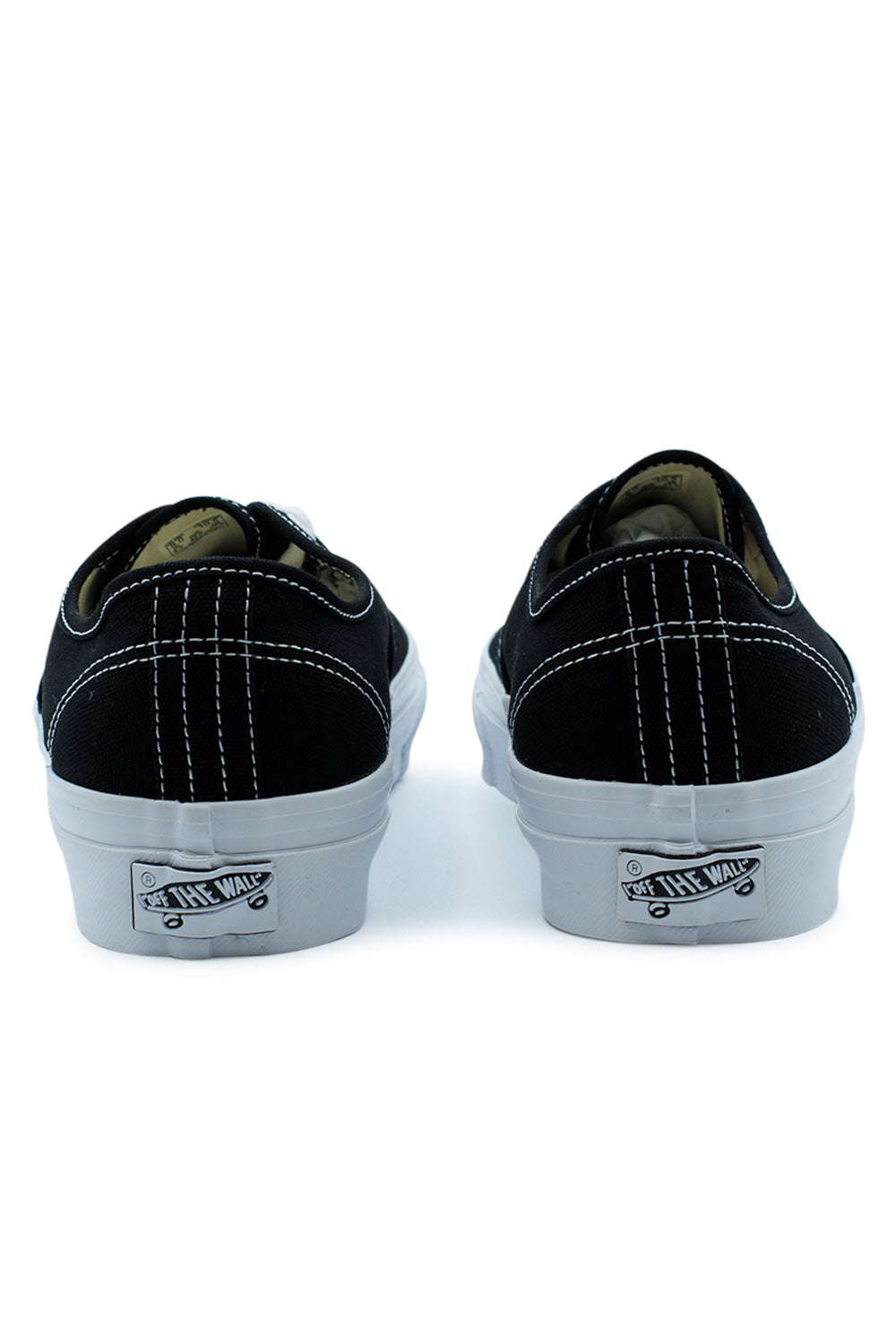 Rear view of the Vans LX Authentic Reissue 44 Shoe Black / White highlighting the historic striped heel stitching, signature Off The Wall heel license plate, elevated glossy sidewall, archival construction and timeless heritage skateboarding design recreated from the original Vans Style 44.