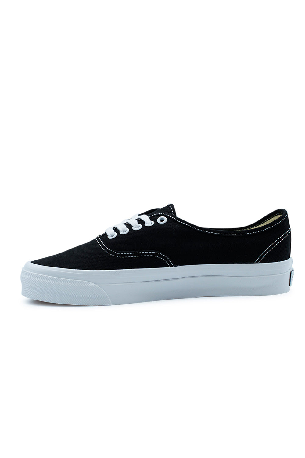 Lateral view of the Vans LX Authentic Reissue 44 Black / White featuring premium 226g canvas, minimalist low-profile skate silhouette, contrast white stitching, higher sidewall foxing, Sola Foam All-Day Comfort ADC sockliner and authentic Vans Premium archive design.